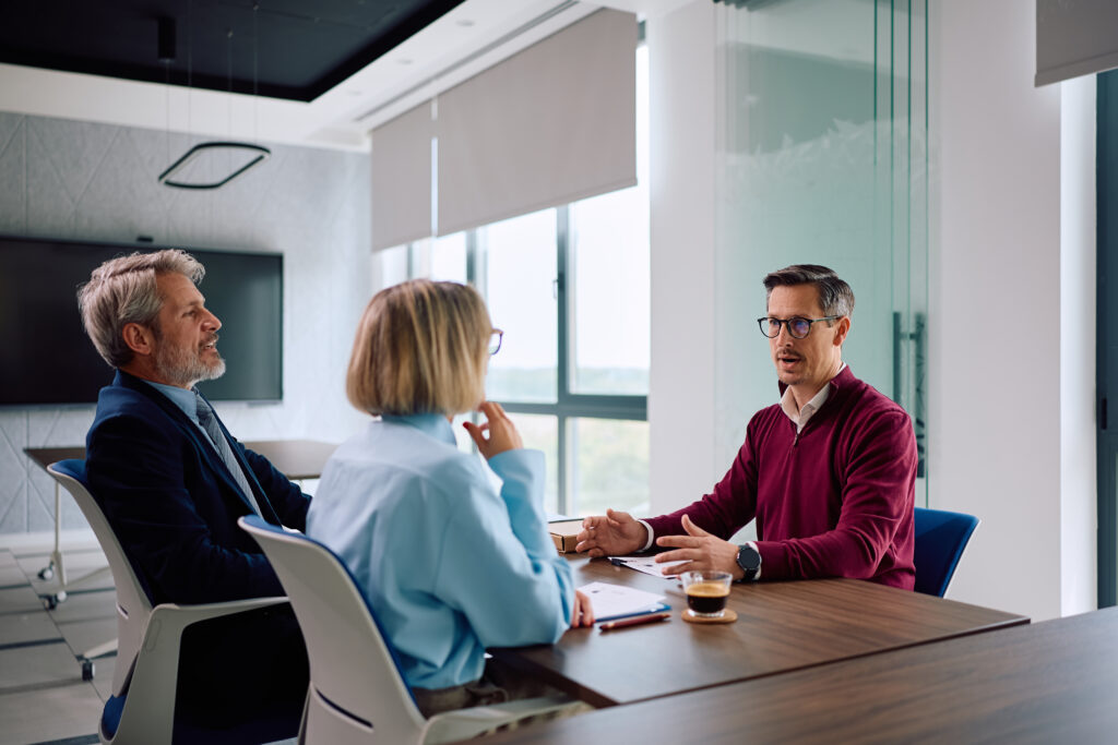 male candidate talking to human resource managers for Buy-Sell Agreements for Georgia Small Business Owners: What Happens When a Partner Leaves, Dies, or Can't Work Anymore