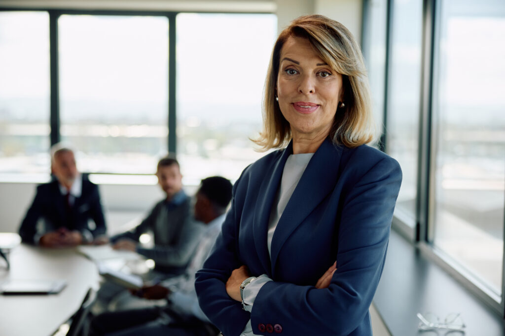 confident woman leads meeting in modern office for Trade Secrets and Confidential Information in Georgia: What Your Business Actually Needs to Protect Itself