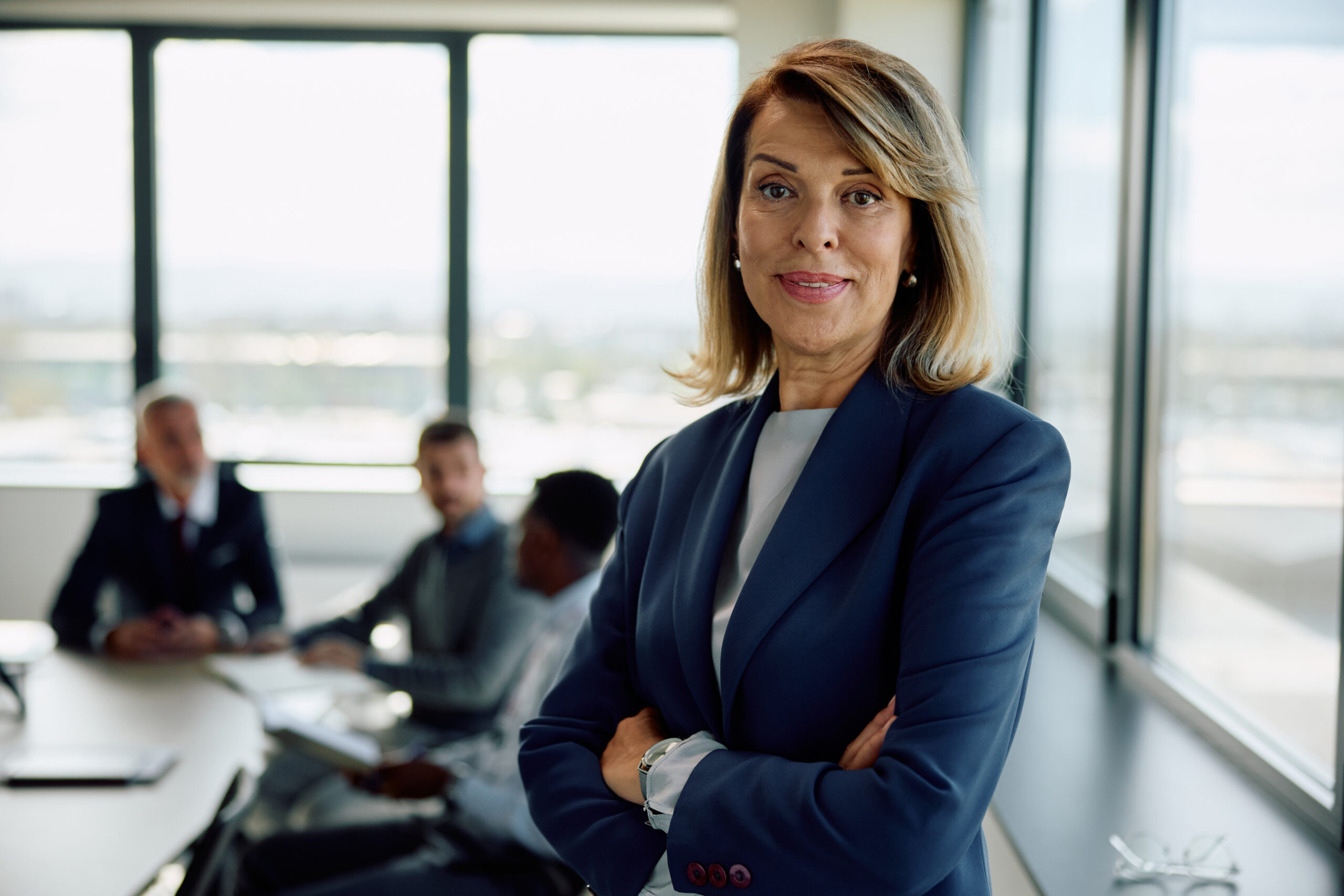 confident woman leads meeting in modern office for Trade Secrets and Confidential Information in Georgia: What Your Business Actually Needs to Protect Itself